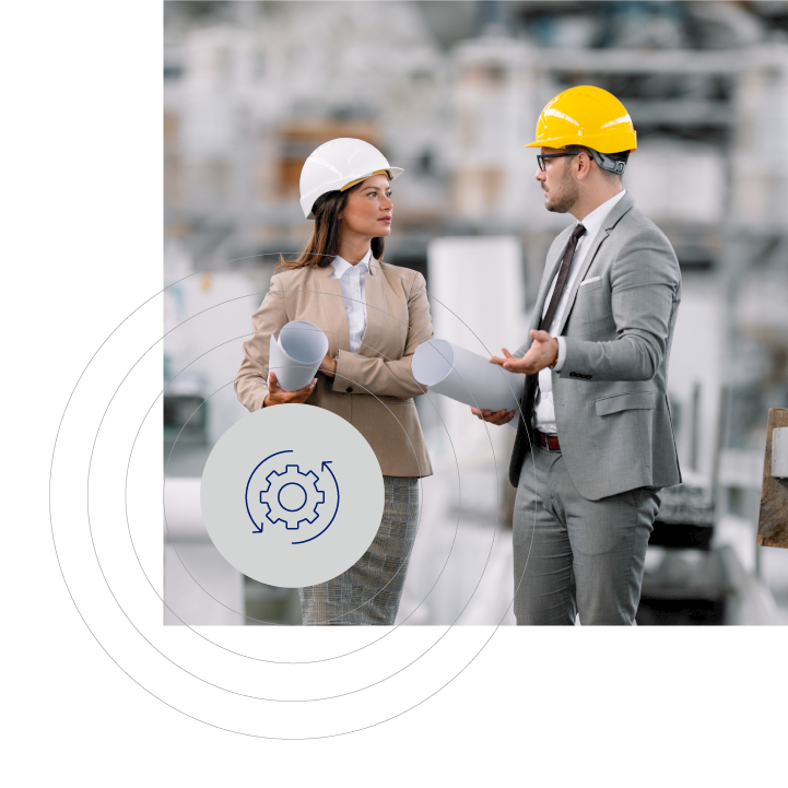 Full indoor shot of two professionals in hard hats discussing blueprints, with a gear symbol overlay. Background shows a building site in light-gray and beige tones
